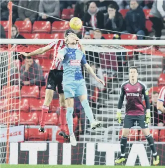  ??  ?? Jack Baldwin wins a header against Wycombe,