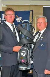  ??  ?? Nomads captain Douw de Lange (left) hands over the prize of the Golden Harvest golf bag draw to Barry Danvers.