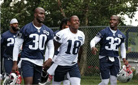  ?? NANcy lANE / HErAld sTAFF FilE ?? ‘ALWAYS SET A GREAT EXAMPLE’: James White says Jason and Devin McCourty (left and right) and Matthew Slater (center) are players that set a high standard with their actions in the community.