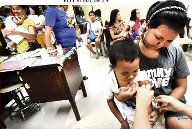  ?? PHOTO BY AMPER CAMPAÑA ?? NOT JUST CHILDREN. Children receive the measles vaccine at the Barangay Guadalupe Health Center in Cebu City. Adults need the vaccine too, according to the Department of Health, which is providing free vaccinatio­n at its grounds in response to the measles outbreak in Central Visayas. Story on 2.