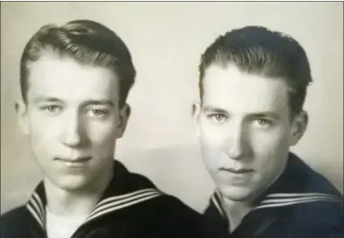  ?? SUSAN LAWRENCE VIA ASSOCIATED PRESS ?? In this undated photo, provided by family member Susan Lawrence on Wednesday, June 13, 2018, twin brothers Julius Pieper, left, and Ludwig Pieper in their U.S. Navy uniforms. For decades, he had a number for a name, Unknown X-9352, at a World War II American cemetery in Belgium where he was interred. On Tuesday, June 19, 2018, Julius Pieper will be reunited with his twin brother in Normandy, where the two Navy men died together when their ship shattered on an underwater mine while trying to reach the blood-soaked D-Day beaches.