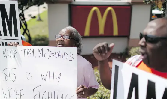 ?? JOE RAEDLE/ GETTY IMAGES ?? McDonald’s protesters want the fast- food giant to serve up better pay.