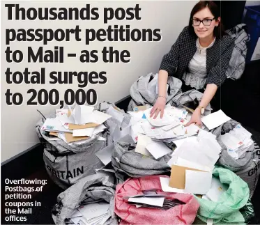  ??  ?? Overflowin­g: Postbags of petition coupons in the Mail offices