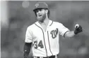  ?? Associated Press ?? n Washington Nationals' Bryce Harper reacts after he flew out during the fourth inning of the team's baseball game against the Milwaukee Brewers on Wednesday in Washington.