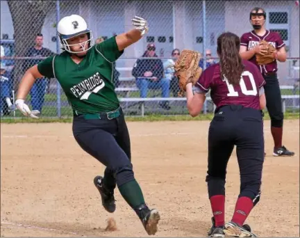  ?? BOB RAINES — DIGITAL FIRST MEDIA ?? Grace McGinley’s (Pennridge) force out by Sam Andrews (Abington) at first base advances Logan Scott to third base Tuesday.