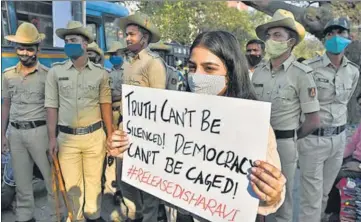  ?? REUTERS ?? A woman holding a placard during a protest against the arrest of climate activist Disha Ravi in Bengaluru.