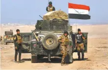  ?? AP-Yonhap ?? Iraqi special forces advance towards the western side of Mosul, Iraq, Thursday.