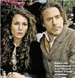  ??  ?? Rapace with Robert Downey Jr. in “Sherlock Holmes: A Game of Shadows”