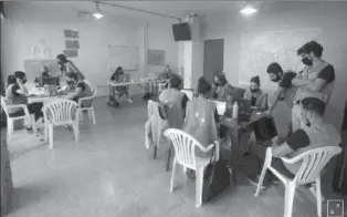  ?? BEIRUT
-REUTERS ?? Volunteers work together inside a room at Beit el Baraka, a local NGO, in Beirut, Lebanon.