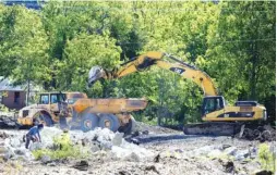  ?? STAFF PHOTO BY C.B. SCHMELTER ?? The former Standard-Coosa-Thatcher mill site is worked with heavy machinery Monday.