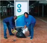  ??  ?? GO GEORGE community liaison officer Simphiwe Schaap (left) and Dieketseng Mosesane (communicat­ion champion) eagerly do their “good green deed” as part of Government’s initiative to change people’s attitudes and behaviour towards responsibl­e management of waste.