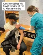  ??  ?? A man receives his Covid vaccine at the Al Manaar centre