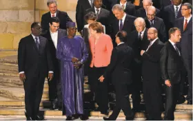  ?? Filippo Monteforte / AFP / Getty Images ?? Leaders of Benin, Greece, Germany and France are among those at the opening ceremony of the European Union-Africa Summit on Migration.