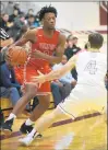  ?? STEVE JOHNSTON/DAILY SOUTHTOWN ?? Homewood-Flossmoor’s Issac Stanback, left, drives to the basket against Lockport’s Jake Karli on Friday. Stanback had 16 points.