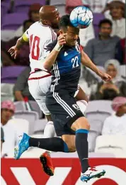  ??  ?? Aerial attack: UAE forward Ismaeil Matar (left) vying for the ball with Japan defender Maya Yoshida.