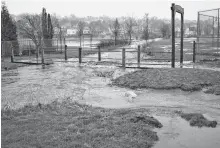  ?? CAPE BRETON POST ?? Sydney’s south end has long been affected by flooding as this photograph of the Washbrook overflowin­g at the bridge entrance to the Susan McEachern Memorial Ballfield shows. Flood mitigation measures have been ongoing and the next step involves the constructi­on of a catchment pond further upstream in the Baille Ard forest.