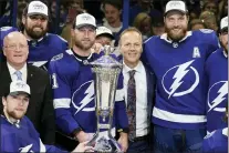  ?? CHRIS O’MEARA — THE ASSOCIATED PRESS ?? Lightning center Steven Stamkos, head coach Jon Cooper, and defenseman Victor Hedman pose with the Prince of Wales Trophy after the team defeated the Rangers in Game 6 of the Eastern Conference finals Saturday in Tampa, Fla.