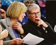  ?? Jessica Hill / Associated Press ?? UConn associate head coach Chris Dailey, left, speaks with head coach Geno Auriemma during a December game in Storrs.