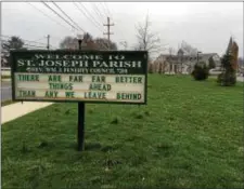  ?? MICHAEL RELLAHAN – DIGITAL FIRST MEDIA ?? Sign outside St. Joseph’s Roman Catholic Parish in Downingtow­n Sunday.