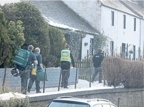  ??  ?? TRAGEDY: Police and paramedics at the scene in Bridgeton Brae and Lumsden Crescent, Almondbank, yesterday.