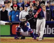  ?? ASSOCIATED PRESS ?? BOSTON RED SOX’S STEVE PEARCE hits a three RBI-double against the Los Angeles Dodgers during the ninth inning in Game 4 of the World Series on Saturday in Los Angeles.