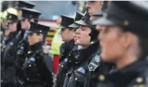  ??  ?? Members of the Gardai in Drogheda stand to attention