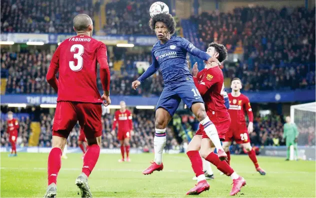  ?? Reuters ?? ↑ Chelsea’s Willian heads the ball during their FA Cup match against Liverpool on Tuesday.