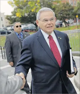  ?? Seth Wenig Associated Press ?? SEN. ROBERT MENENDEZ, a Democrat from New Jersey, faces corruption charges over his longtime friendship with a wealthy Florida doctor.