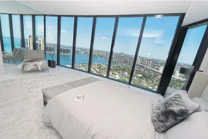  ??  ?? The Porsche Design Tower has many amenities for residents including all condos having a view of the ocean and the bay as seen in this bedroom.