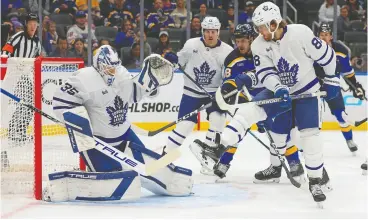  ?? DILIP VISHWANAT / GETTY IMAGES ?? Maple Leafs forward William Nylander, right, battles for position with a Blues player
in front of goalie Ilya Samsonov on Monday in St. Louis.