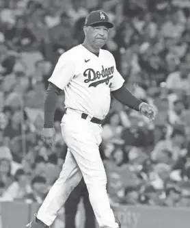  ?? KIRBY LEE/USA TODAY SPORTS ?? Dodgers manager Dave Roberts looks on during a game against the Padres on Sept. 11 in Los Angeles.