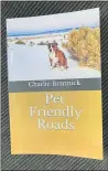  ?? HEATHER SHELTON — THE TIMESSTAND­ARD ?? “Pet Friendly Roads” is a new book by Eureka author Charlie Brannick. The photo on the book’s cover shows Brannick’s dog, Luigi, at White Sands National Park.