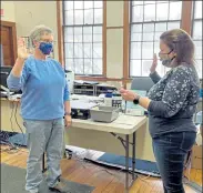  ?? COURTESY CATHY BILIOURIS / SENTINEL & ENTERPRISE ?? Cathy Biliouris, left, was sworn in by Ashby Town Clerk Angela Jack as a member of the Ashby Board of Selectmen Wednesday morning after winning a special town election on Tuesday to fill the unexpired term of Scott Sweeney.