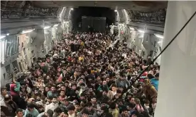  ??  ?? Around 640 Afghan evacuees crowd the inside of a US Air Force Globemaste­r III transport aircraft on its way to Qatar from Kabul Photograph: Courtesy Of Defense One/Reuters