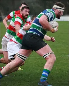  ??  ?? Stephen Gardiner powers away from Bective’s Phil McCarthy.