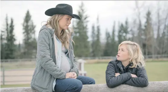 ?? ANDREW BAKO ?? Amber Marshall and Jessica Amlee, in Heartland. Amlee’s character, Mallory, returns to the show on Sunday.