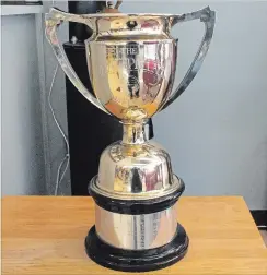  ?? SPECIAL TO THE EXAMINER ?? Early local soccer teams competed for the Phelan Charity Cup, also known as the Father Phelan Trophy, designed by local store owner F.W. Clarke.