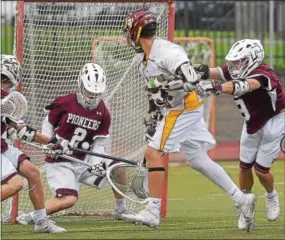  ?? PETE BANNAN — DIGITAL FIRST MEDIA ?? Conestoga goalie Scott MacMillan makes a save on Avon Grove’s Brendan Harman in the second half Thursday night.