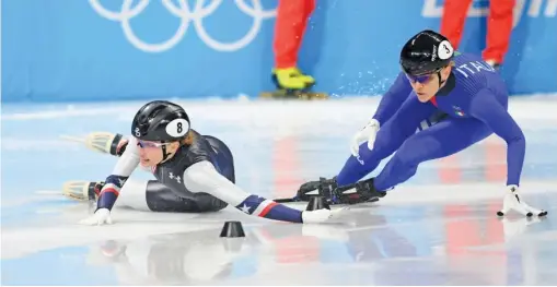  ?? JUSTIN SETTERFIEL­D/GETTY IMAGES ?? U.S. skater Kristen Santos (left) failed to medal in short-track skating after being bumped in both the 1,000 and 1,500 meters.