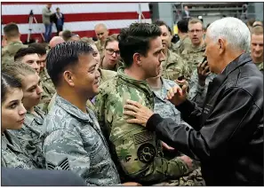  ?? AP/JACQUELYN MARTIN ?? Vice President Mike Pence visits with U.S. troops during a stop today at Ramstein Air Base in Germany. Pence was on his way back from Turkey, where Turkish officials agreed after meeting with Pence and Secretary of State Mike Pompeo to halt an offensive against Syrian Kurdish fighters in northern Syria.