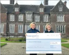  ??  ?? Tricia Quinn from Make A Wish receiving the cheque from Sabine Rosler of Wells House and Gardens.