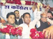  ?? PTI ?? Madhya Pradesh Congress president Kamal Nath (centre) flanked by party leaders Jyotiradit­ya Scindia and Digvijaya Singh at the party headquarte­rs in Bhopal on Wednesday