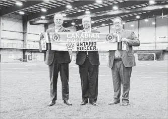  ?? THE CANADIAN PRESS ?? From left: Ontario Soccer CEO Johnny Misley, Canadian Premier League commission­er David Clanachan and League 1 commission­er Dino Rossi. The CPL has bought League 1 and plans to use the league to develop talent.