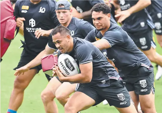  ??  ?? Titans winger Phillip Sami trains with the Maroons at Cbus Super Stadium. Picture: Bradley Kanaris/Getty Images