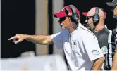  ??  ?? Aggies head coach Doug Martin directs players last month in Fayettevil­le, Ark.