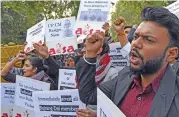  ?? (AFP) ?? All India Students Associatio­n members protest outside Uttar Pradesh Bhavan, the state government house, in New Delhi on Friday