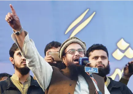  ??  ?? Jamaat-ud-Dawa leader Hafiz Saeed addresses supporters in Lahore. (AFP/file)