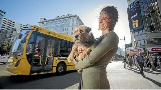  ?? PHOTO: ROBERT KITCHIN/STUFF ?? Sophie Macdonald will soon be allowed to take her dog, Rufus, with her on Wellington’s buses and trains after the regional council voted to allow pets on public transport.