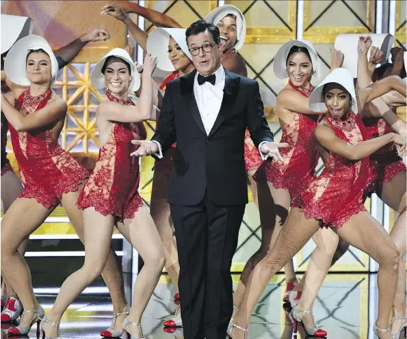  ?? FREDERIC J. BROWN/GETTY IMAGES ?? 2017 Emmy host Stephen Colbert dances onstage during the 69th edition of the awards last September.