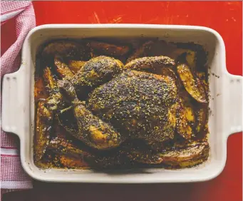  ?? DAN PEREZ ?? “It’s very simple, but it’s also very special,” cookbook author Adeena Sussman says of her roasted chicken. A za’atar spice blend adds some welcome zest to the hearty, comforting dish.